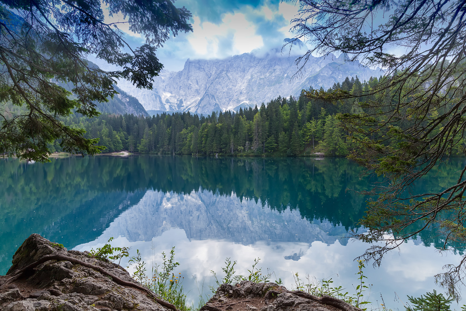 The lower Belopeško lake (Laghi di Fusine in italian) with magnificient Mangart mountain massif in the backdrop offers good opportunities for a snapshot.