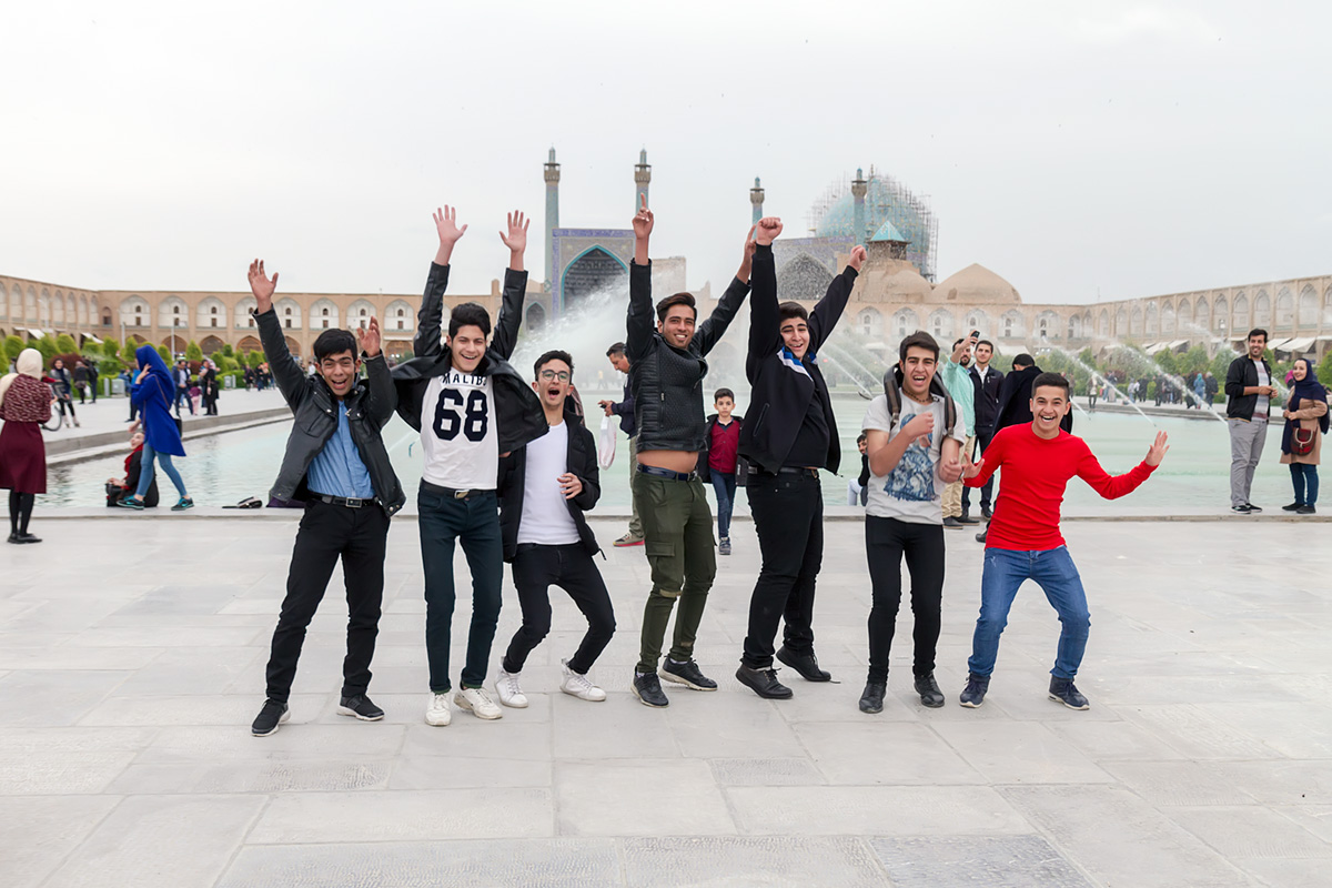 The youngsters in Esfahan, using their basic knowledge of English, asked me if I can take a photo of them. At first they were quite rigid and weren\'t sure what I want, but soon they were jumping in front of my lens. I sent them the picture and they were really happy about it.