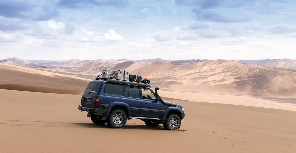 Our Landcruiser in the Lut desert in Iran, among proper dunes