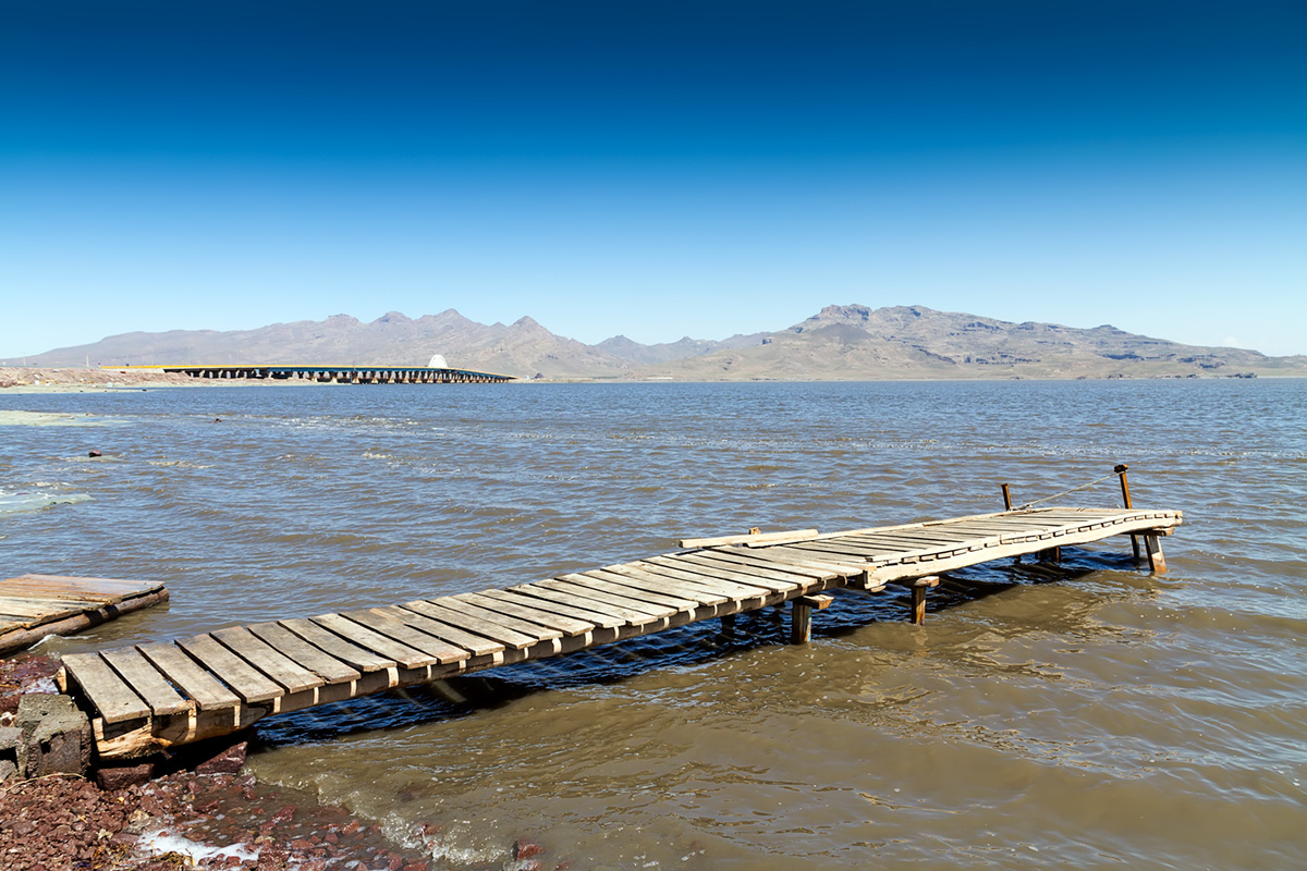 The wooden pier at Lake Urmia used by local fishermen mostly.The wooden pier at Lake Urmia used by local fishermen mostly. In the backdrop there is the bridge carrying the highway between cities of Urmia and Tabriz.
